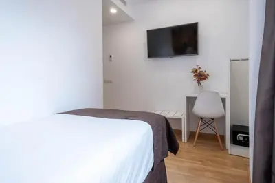 Cama o camas de una habitación en Hotel BESTPRICE Girona
