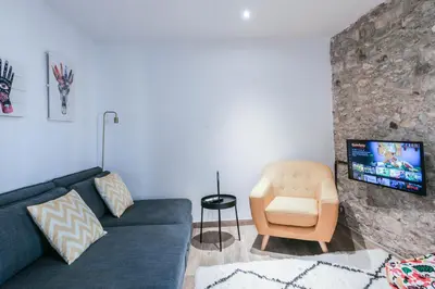 Una televisión o centro de entretenimiento en Tresor Boutique Apartment