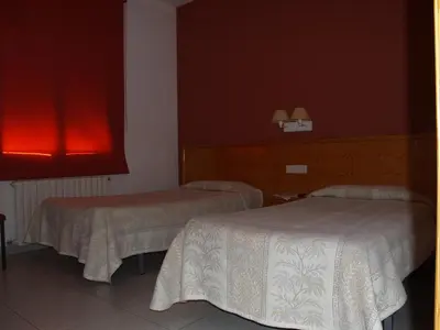 Cama o camas de una habitación en Hostal Barnes