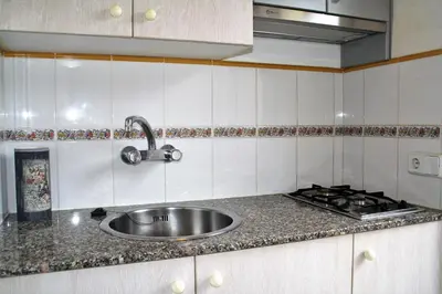 Una cocina o zona de cocina en Apartaments Ocean Canada