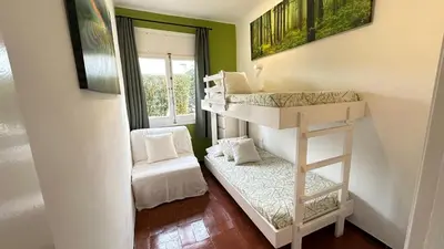 Cama o camas de una habitación en Apartamento con jardín a 11 metros de la playa. B1.