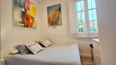 Cama o camas de una habitación en Casa con jardín a 30 metros de la playa. VL.