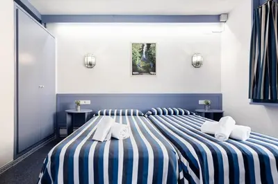 Cama o camas de una habitación en El Trull Apartments
