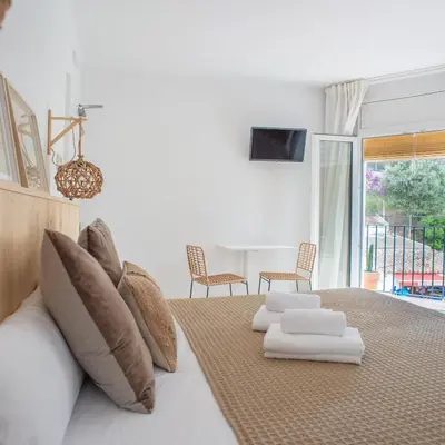 Cama o camas de una habitación en Hostal Sa Teula