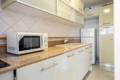 Una cocina o zona de cocina en Hauzify I Apartament Cannes