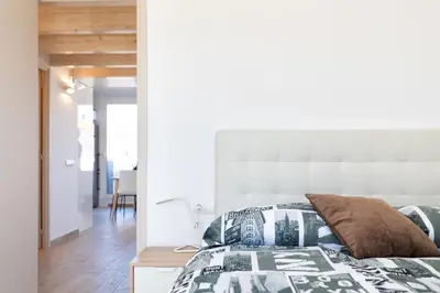 Cama o camas de una habitación en Hauzify I Apartament 4Winds