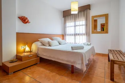 Cama o camas de una habitación en HomeHolidaysRentals Adara