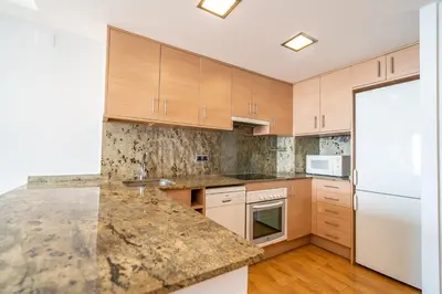 Una cocina o zona de cocina en HomeHolidaysRentals Marella - Costa Barcelona
