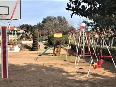 Zona de juegos infantil en Apartamento Palmeras en Platja d'Aro