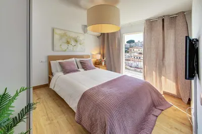 Cama o camas de una habitación en APARTAMENT PAU CASALS, 2 min walk from the sea & sea view