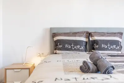 Cama o camas de una habitación en Hauzify I Apartament Big Family