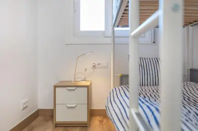 Cama o camas de una habitación en Hauzify I Apartament Big Family