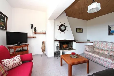 Una televisión o centro de entretenimiento en Villa Soleil