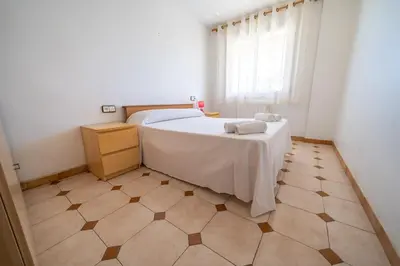 Cama o camas de una habitación en HomeHolidaysRentals Destan - Costa Barcelona