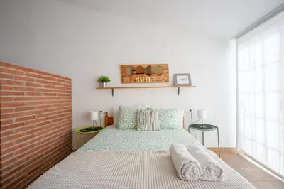 Cama o camas de una habitación en CHIC APARTAMENTS