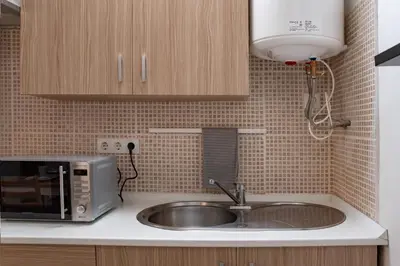 Una cocina o zona de cocina en RESIDENCE du SOLEIL