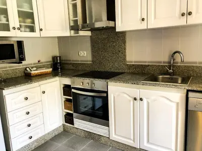 Una cocina o zona de cocina en APARTAMENTO VACACIONAL - RELAX