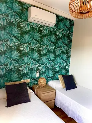 Cama o camas de una habitación en FENALS BEACH&CHIC, Boutique Apartament, free parking, full equipped near the beach