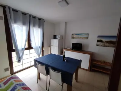 Una televisión o centro de entretenimiento en Apartamento Zodiac AB 6H