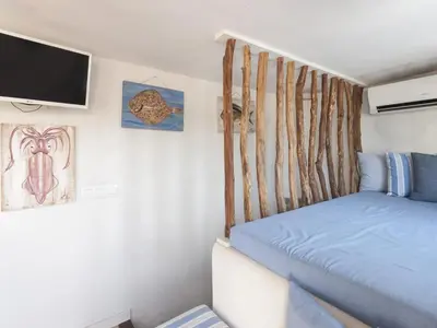 Cama o camas de una habitación en Lets Holidays Charming fisherman house with terrace