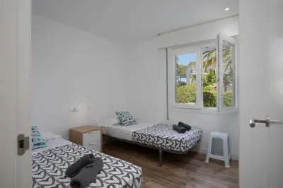 Cama o camas de una habitación en Apartament amb piscina i aparcament - Baixos amb jardinet