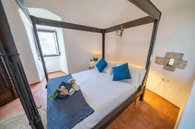Cama o camas de una habitación en Castillo Can Xirau Piscina Privada Vistas Mar Aire Acondicionado