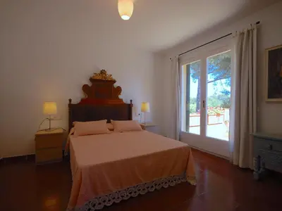 Cama o camas de una habitación en LETS HOLIDAYS Lovely garden house in mar menuda