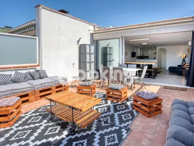 Zona de estar de Begonias Apartament per 4 persones amb gran terrassa chill out a 10 minuts de la platja