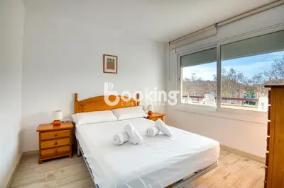 Cama o camas de una habitación en Vall de ribes Apartament per 4 persones amb piscina comunitària, a prop de Port d'Aro