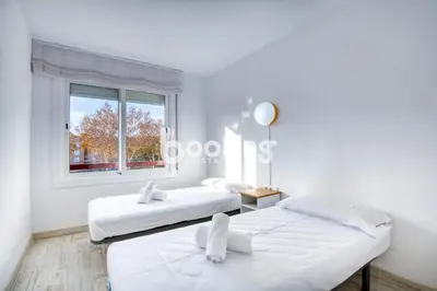 Cama o camas de una habitación en Vall de ribes Apartament per 4 persones amb piscina comunitària, a prop de Port d'Aro