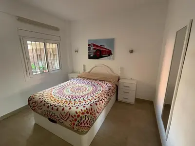 Cama o camas de una habitación en Piso a 150 mts de la playa con espectacular terraza y WIFI