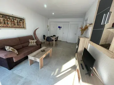 Una televisión o centro de entretenimiento en Piso a 150 mts de la playa con espectacular terraza y WIFI