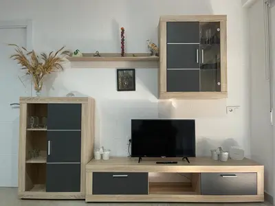 Una televisión o centro de entretenimiento en Piso a 150 mts de la playa con espectacular terraza y WIFI