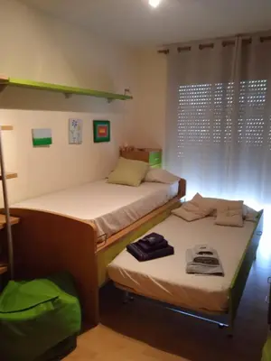 Cama o camas de una habitación en Triplex