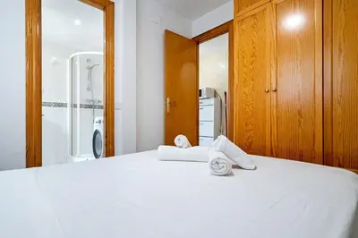 Cama o camas de una habitación en Hauzify I Apartament Estrella