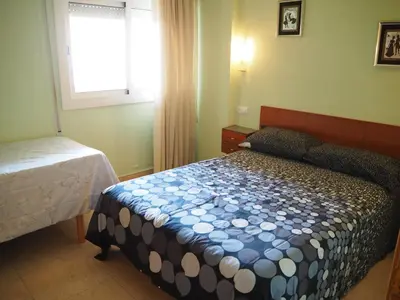 Cama o camas de una habitación en Apartament a 2 minuts de la platja, amb AC