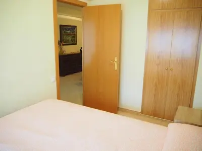 Cama o camas de una habitación en Apartament a 2 minuts de la platja, amb AC