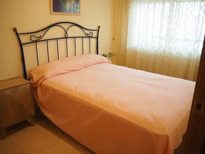 Cama o camas de una habitación en Apartament a 2 minuts de la platja, amb AC