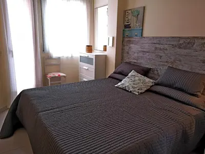 Cama o camas de una habitación en LLOGUER30 Apartamento Lotus, piscina y parquing