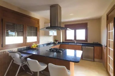 Una cocina o zona de cocina en Club Villamar - Can Olbia
