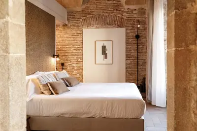 Cama o camas de una habitación en La Comuna by Bon Dia Residences