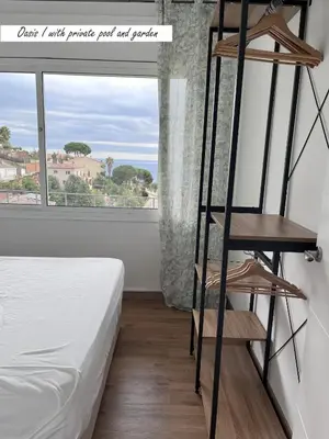 Cama o camas de una habitación en Villa Oasis Costa Brava