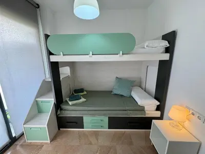 Cama o camas de una habitación en Precioso apartamento 4 habitaciones con piscina y gym