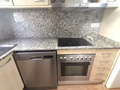 Una cocina o zona de cocina en Precioso apartamento 4 habitaciones con piscina y gym