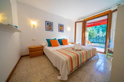 Cama o camas de una habitación en Villa Natura Frente al Mar Piscina Barbacoa Aire Acondicionado