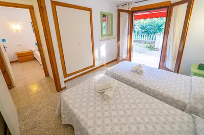 Cama o camas de una habitación en Villa Natura Frente al Mar Piscina Barbacoa Aire Acondicionado