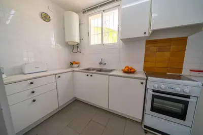 Una cocina o zona de cocina en Villa Vista Piscina Vistas Mar Barbacoa Aire Acondicionado