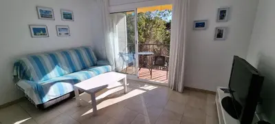 Una televisión o centro de entretenimiento en Sa Shei Apartment Tossa de Mar