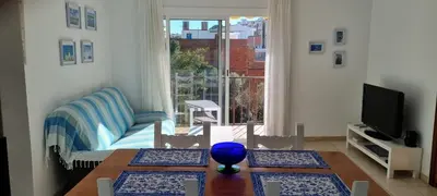 Una televisión o centro de entretenimiento en Sa Shei Apartment Tossa de Mar