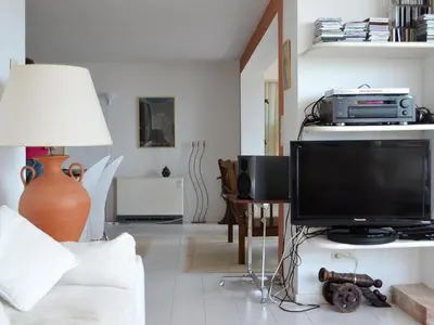 Una televisión o centro de entretenimiento en Apartament singer